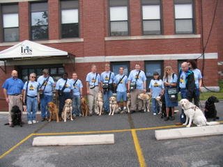 The dog owners in front of the Iris Center