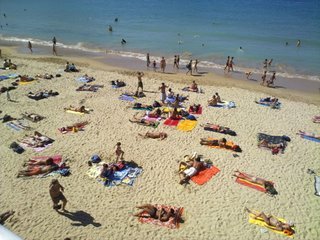 San Sebastian beach full with sunbathers and walkers