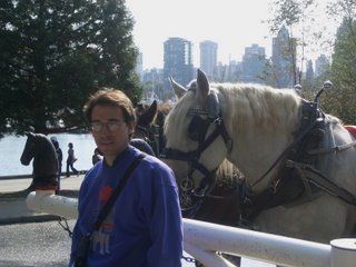 Charles posing for a picture in front of the horses