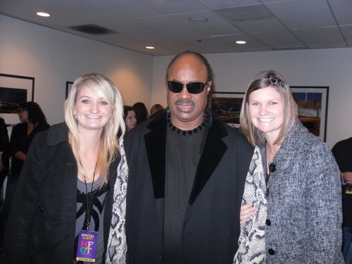 Jamie and Katie Adams with Stevie Wonder at the House Full of Toys benefit concert