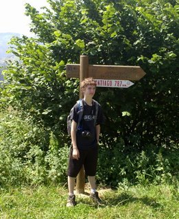 Carson in front of Santiago mileage sign