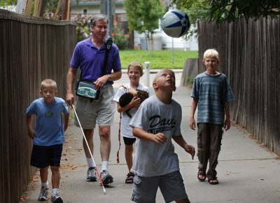 Mike walking with a group of boys