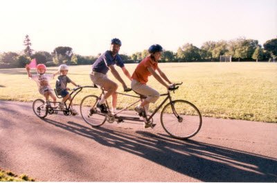 May family on tandem bikes after surgery