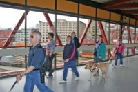 Group of blind travelers navigating through Vancouver, BC